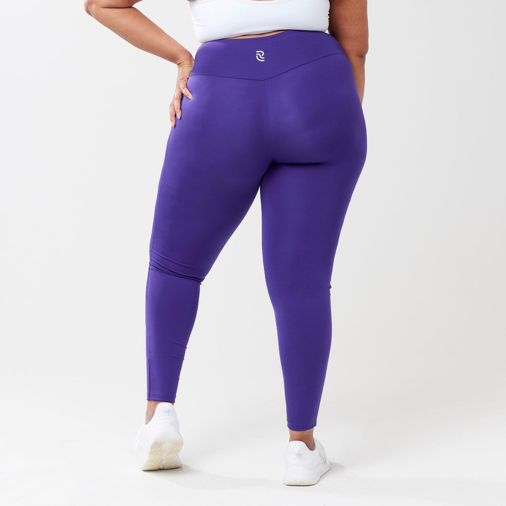 Plus model wearing indigo leggings for use in active lifestyles as well as casual living.