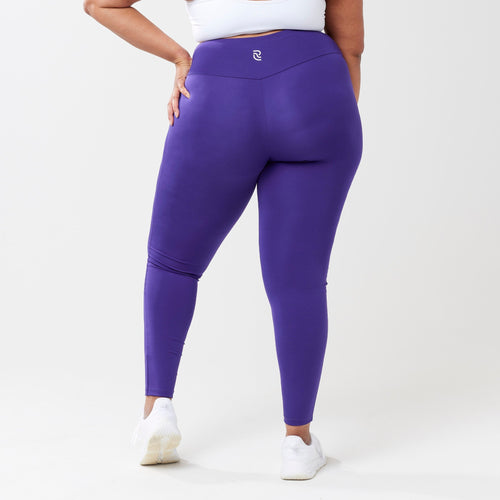 Plus model wearing indigo leggings for use in active lifestyles as well as casual living.