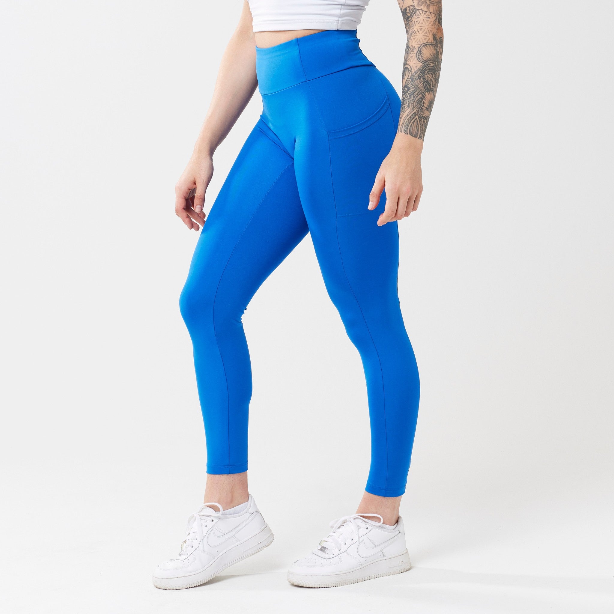 Model wearing cobalt leggings for use in active lifestyles as well as casual living.