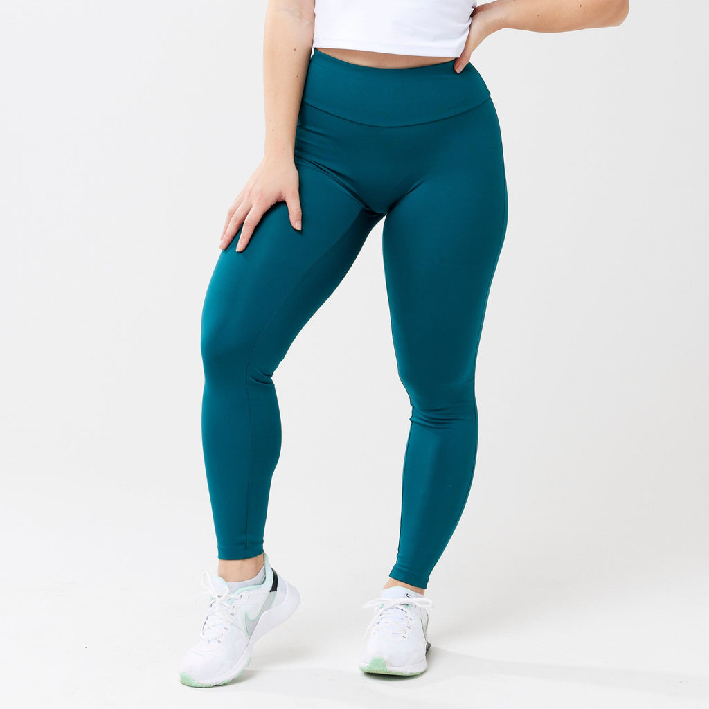 Model wearing rich teal leggings for use in active lifestyles as well as casual living.
